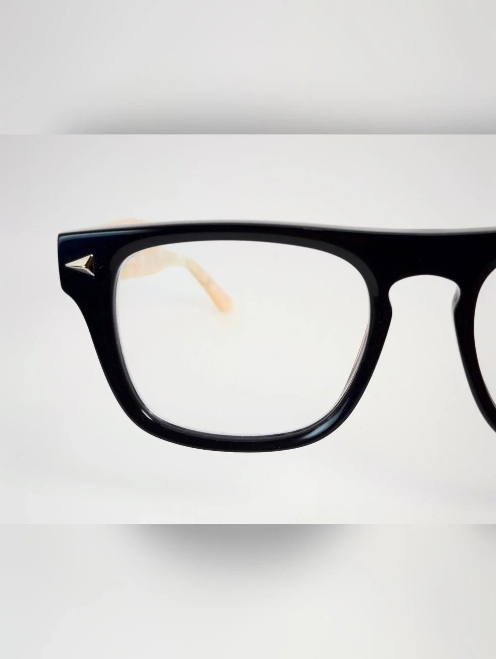 Fluoresce. Black Wayfarer-Style Eyeglasses with Pearl Temples.